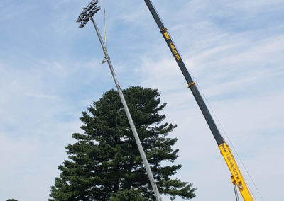 LED stadium light pole being erected on site