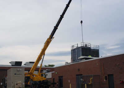 New cooling tower being installed on building