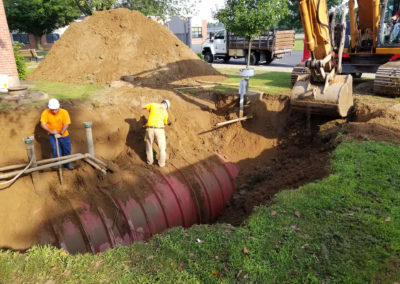 Crew digging up an in ground oil tank