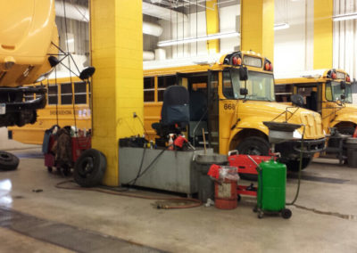 Bus garage with bay areas for school buses